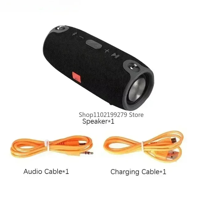 Enceinte Bluetooth portable noire avec boutons intégrés, câble audio jack et câble de charge USB orange