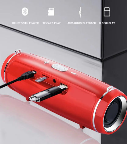 Enceinte Bluetooth rouge cylindrique avec ports USB, carte TF, aux et lecteur USB inséré