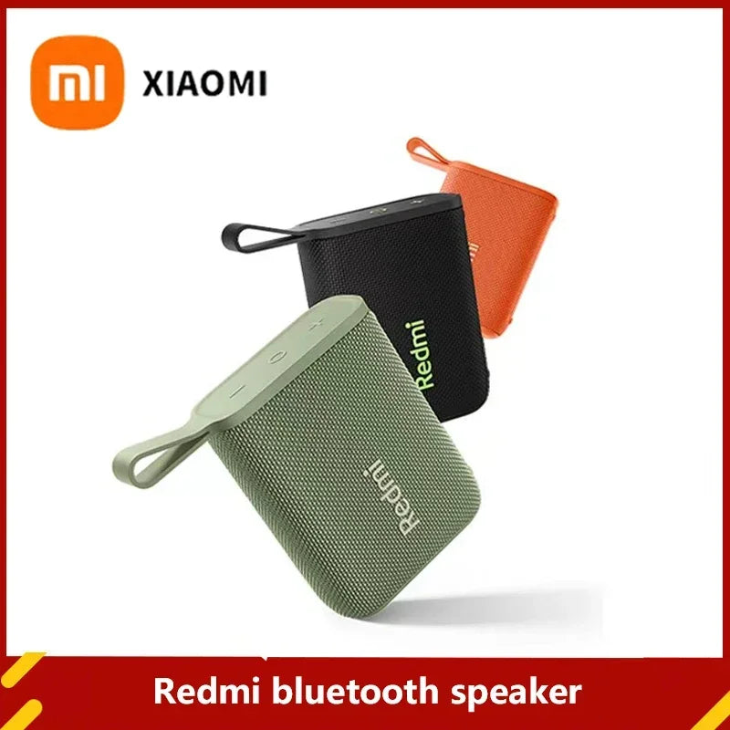 Enceintes Bluetooth Redmi Xiaomi vert, noir et orange au design portable avec boucle