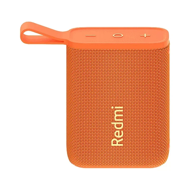 Enceinte Bluetooth portable orange Redmi avec bouton +, -, et multipoint, design textile