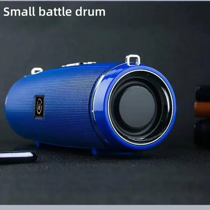 Petit haut-parleur Bluetooth portable bleu avec design cylindrique et grille texturée sur fond noir